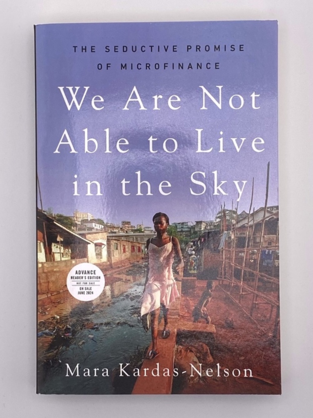 (8) NEW We Are Not Able to Live in the Sky The Seductive Promise of Microfinance